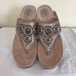 Clarks sandals. Size 11M. Color tan. Never worn. Excellent condition.